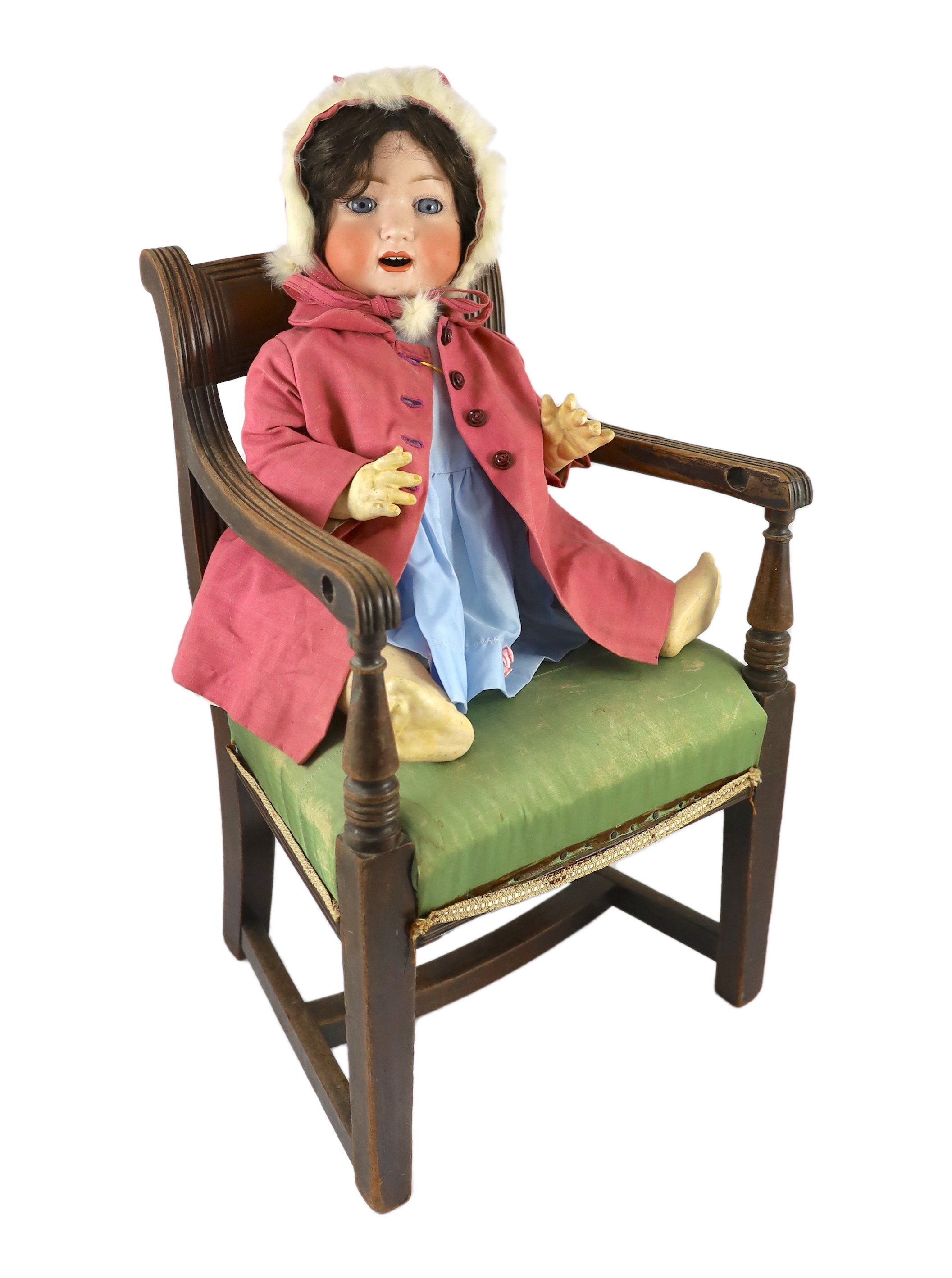 A Heubach Koppelsdorf bisque doll, German, circa 1914, 23in. Please note the chair is for display purposes only.